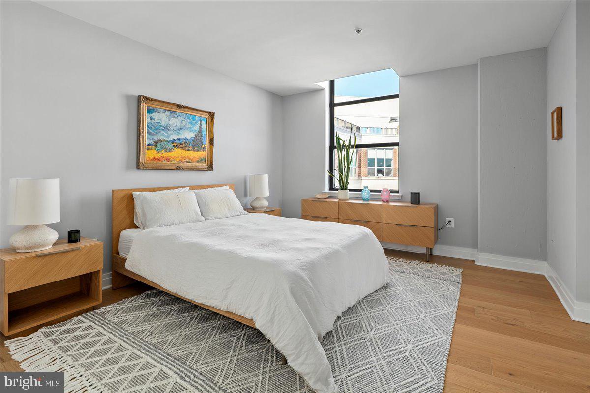 2020 12th Street Northwest, Unit 812 Washington, DC 20009 - Photo 15 of 38 a bedroom with a bed and a window