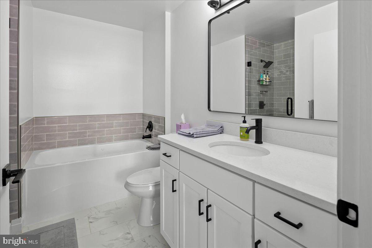 2020 12th Street Northwest, Unit 812 Washington, DC 20009 - Photo 17 of 38 a bathroom with a sink a toilet and shower