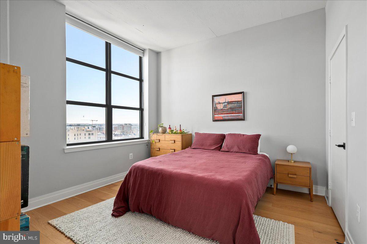 2020 12th Street Northwest, Unit 812 Washington, DC 20009 - Photo 19 of 38 a bedroom with a bed and a window