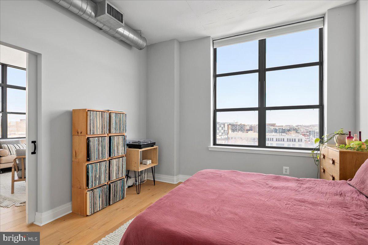 2020 12th Street Northwest, Unit 812 Washington, DC 20009 - Photo 20 of 38 a bedroom with a bed and a window