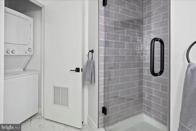 a view of a hallway with wooden floor and windows