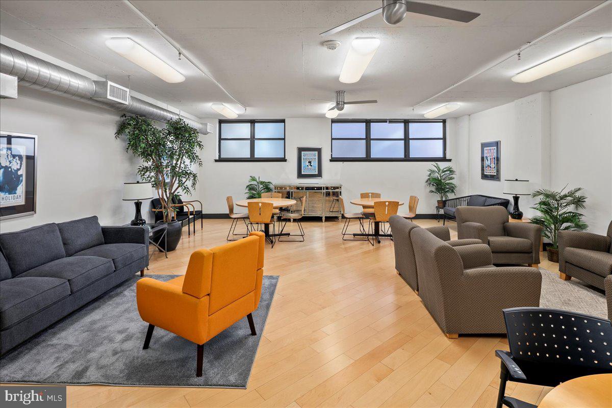 2020 12th Street Northwest, Unit 812 Washington, DC 20009 - Photo 37 of 38 a living room with furniture and a wooden floor