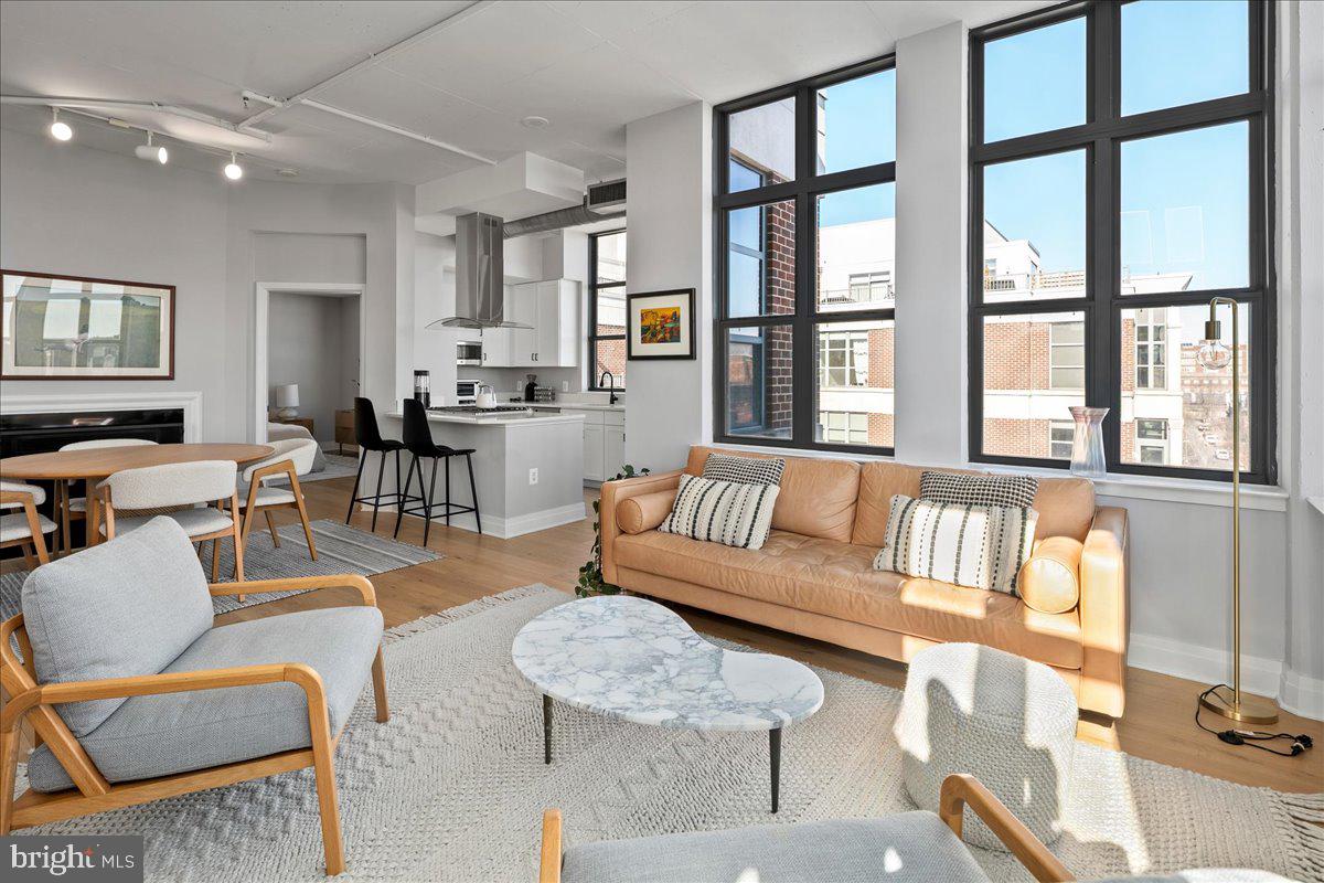 2020 12th Street Northwest, Unit 812 Washington, DC 20009 - Photo 7 of 38 a living room with furniture and a large window