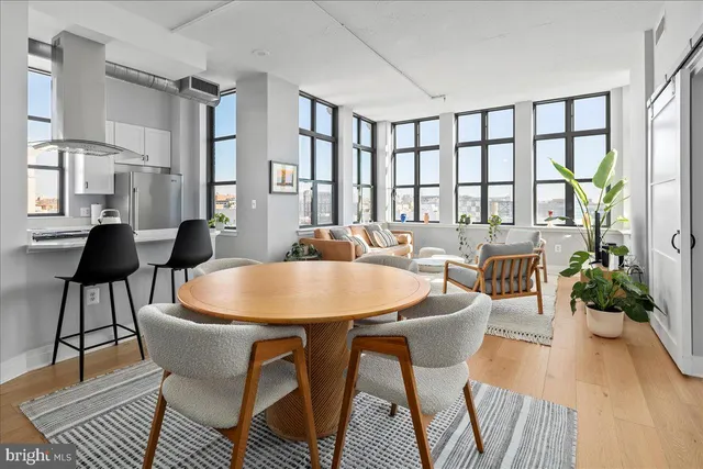 a dining room with furniture and window