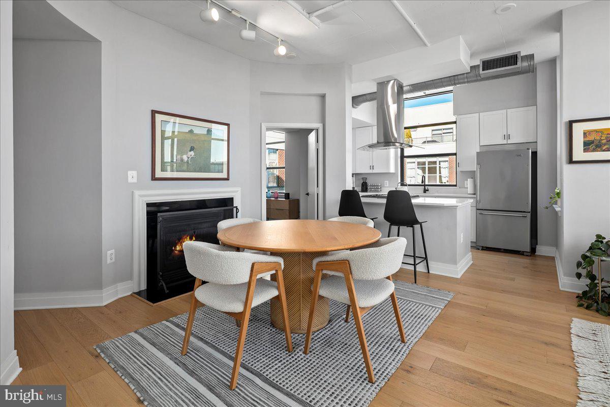 2020 12th Street Northwest, Unit 812 Washington, DC 20009 - Photo 9 of 38 a dining room with furniture and window