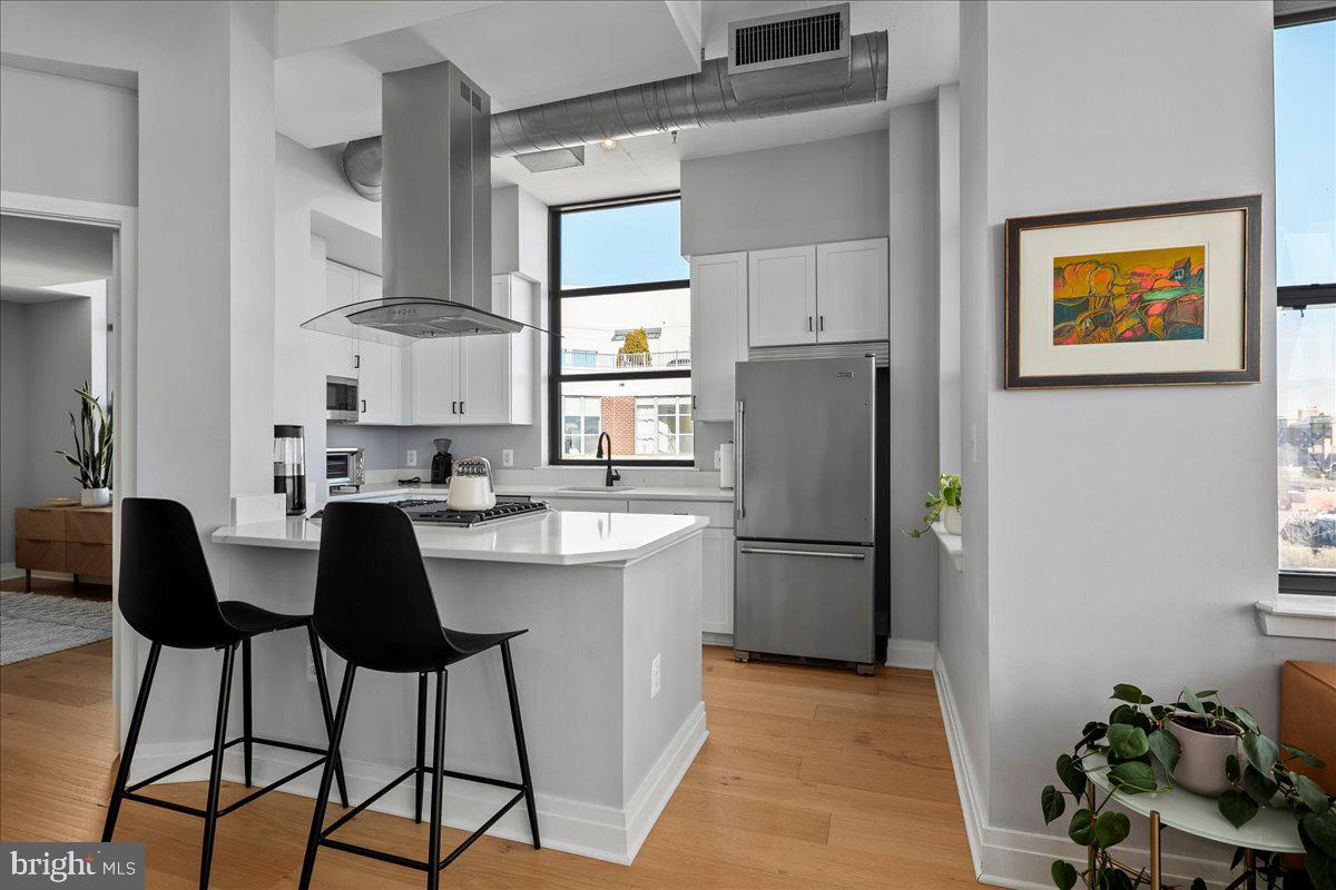 2020 12th Street Northwest, Unit 812 Washington, DC 20009 - Photo 10 of 38 a kitchen with a refrigerator and a sink