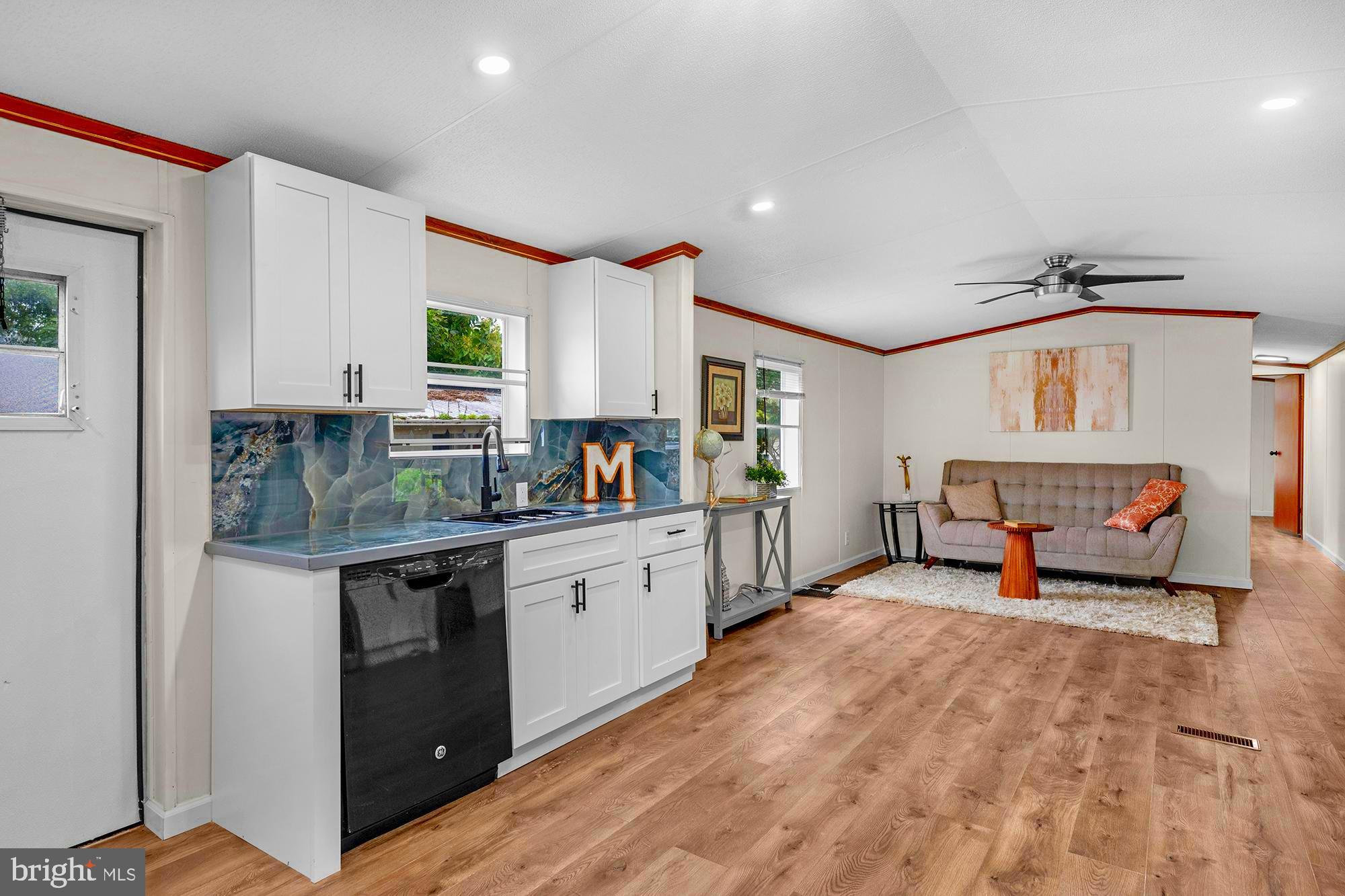 a kitchen with sink cabinets and window
