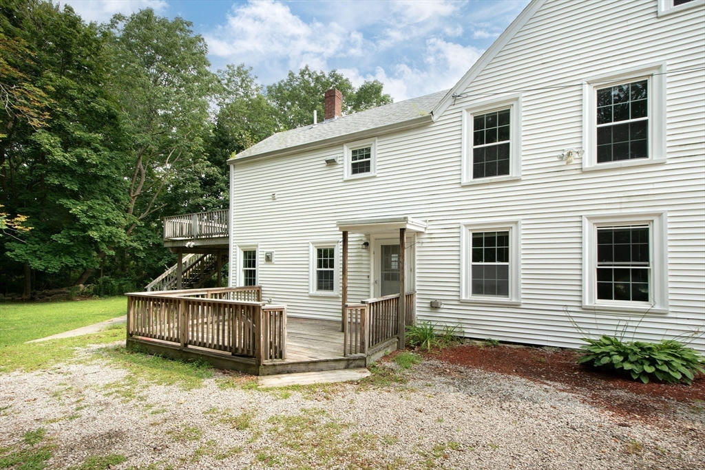 192-194 First Parish Road, Unit 1 Scituate, MA 02066 - Photo 17 of 18 a view of a house with backyard and sitting area