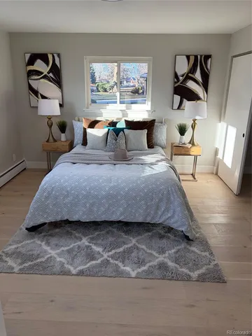 a bedroom with a bed and window