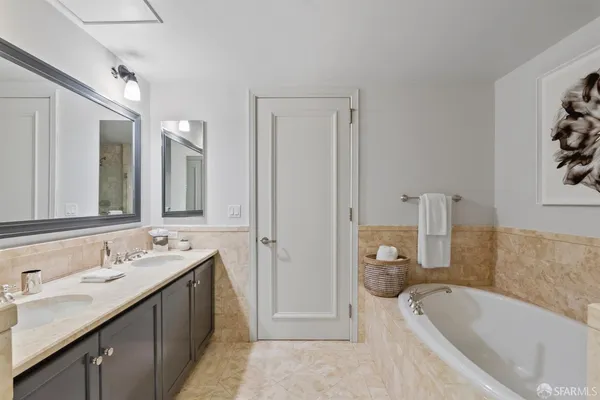a bathroom with a bathtub and a shower