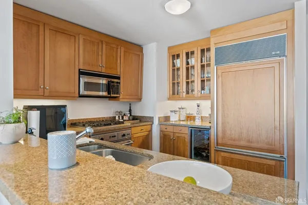 a kitchen with a stove a sink and a microwave