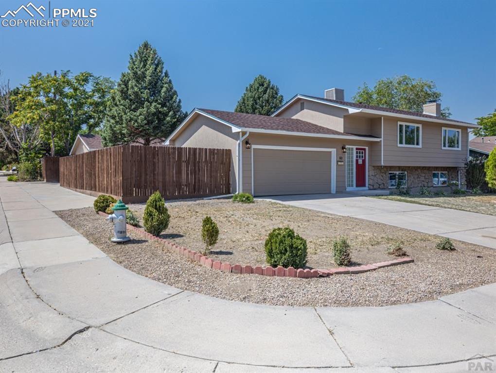 60 Calhoun Road Pueblo, CO 81001 - Photo 31 of 32 a front view of a house with garage