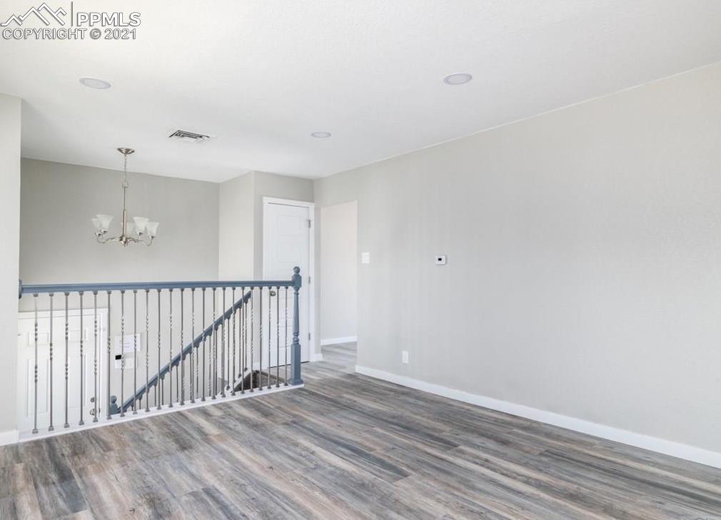 60 Calhoun Road Pueblo, CO 81001 - Photo 5 of 32 a view of a hallway with wooden floor