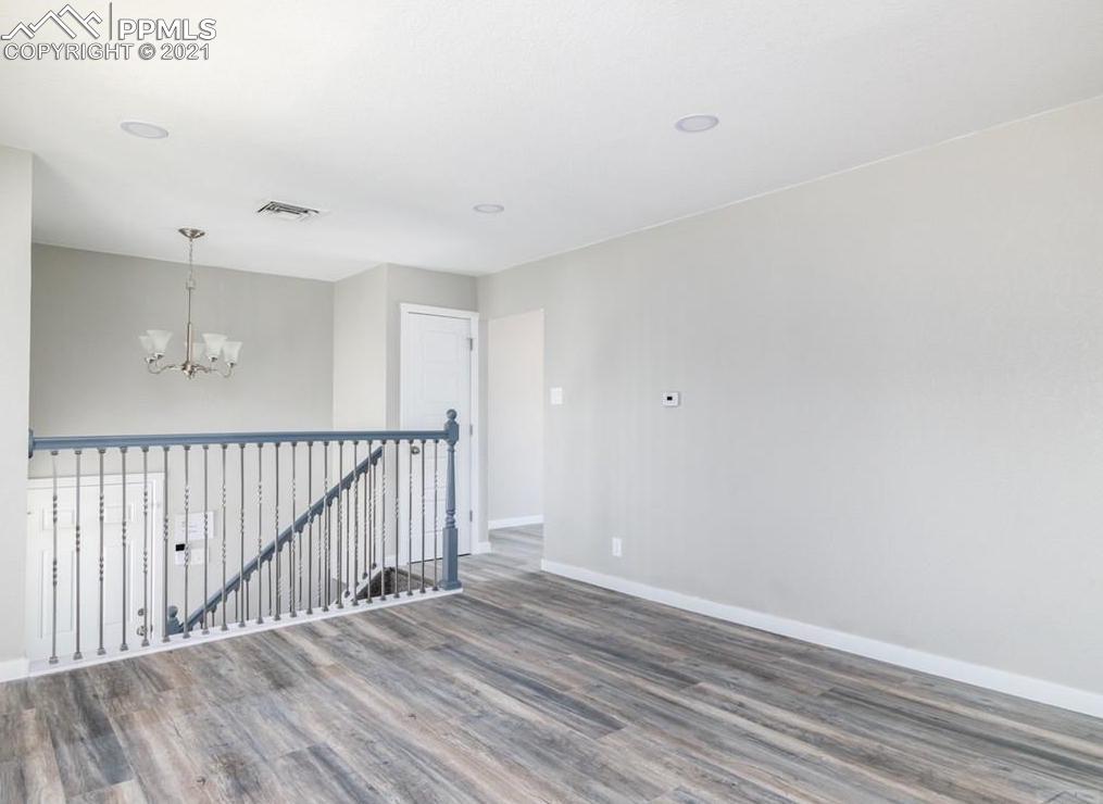 60 Calhoun Road Pueblo, CO 81001 - Photo 7 of 32 a view of a hallway with wooden floor