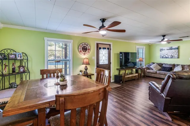 a living room with lots of furniture and a flat screen tv