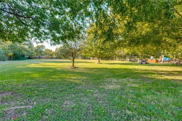 a living room with furniture a rug and a flat screen tv