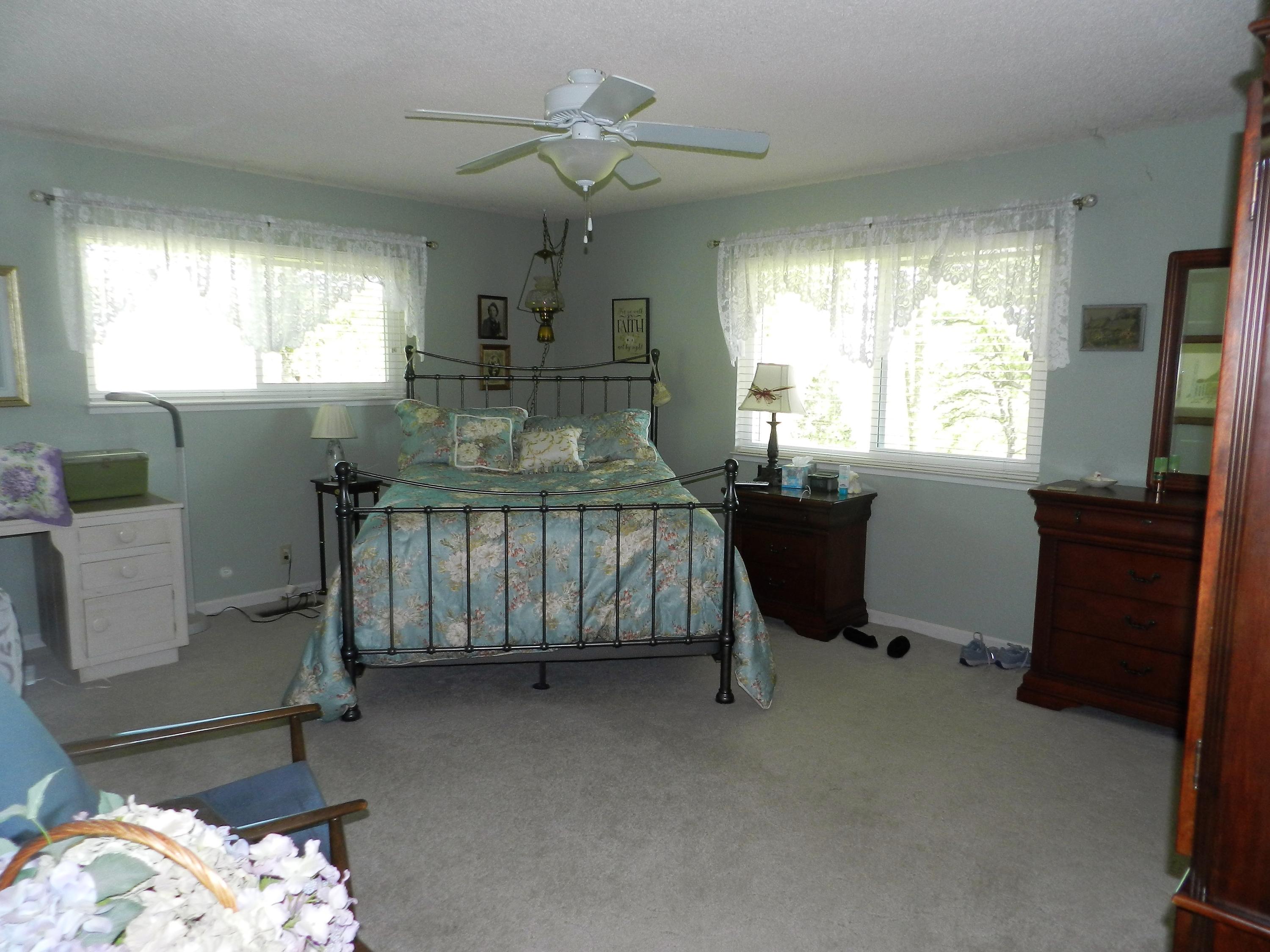8760 Valley View Road Redding, CA 96001 - Photo 11 of 42 a bedroom with bed and window