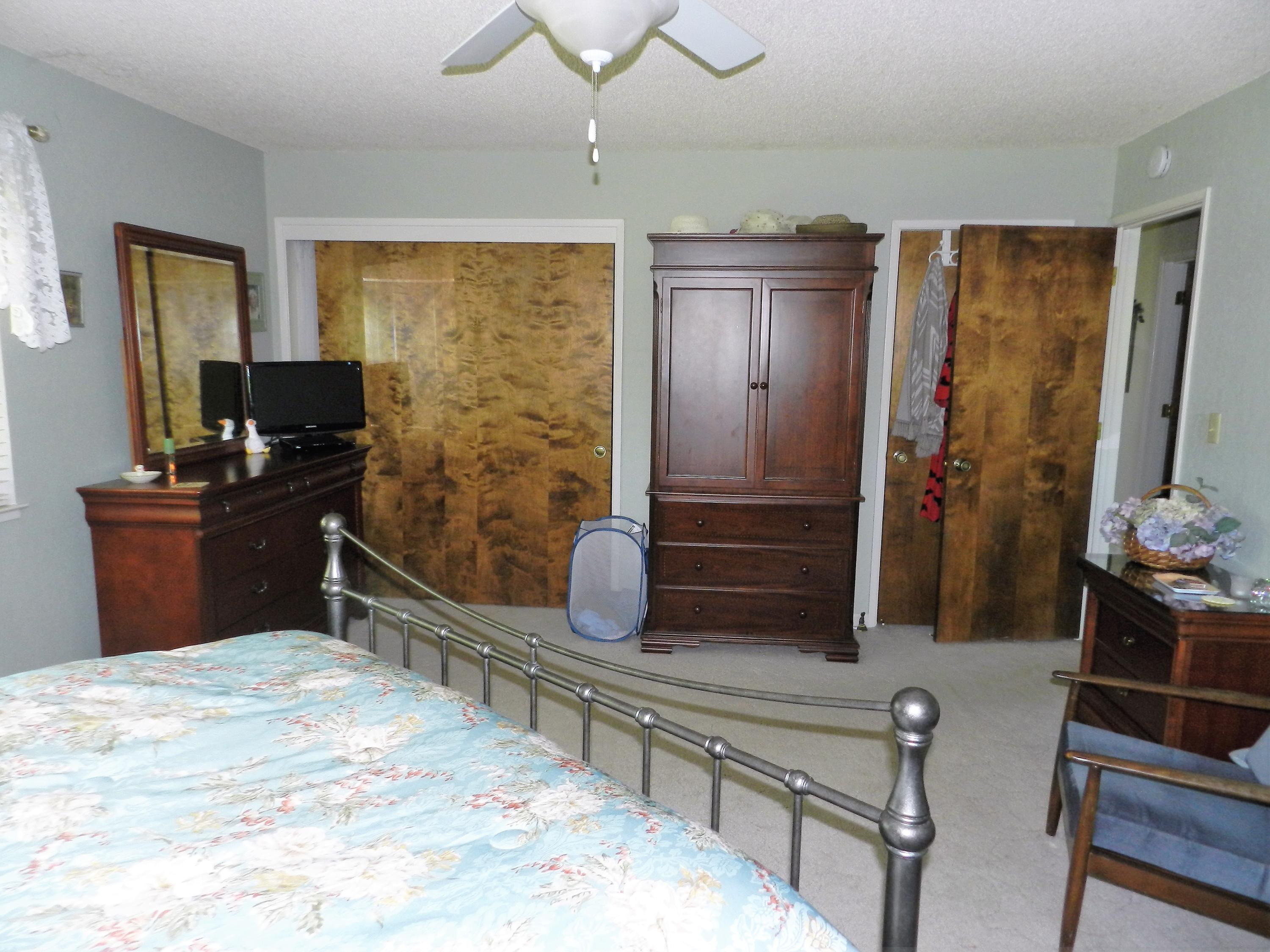 8760 Valley View Road Redding, CA 96001 - Photo 12 of 42 a bedroom with a bed and a dresser