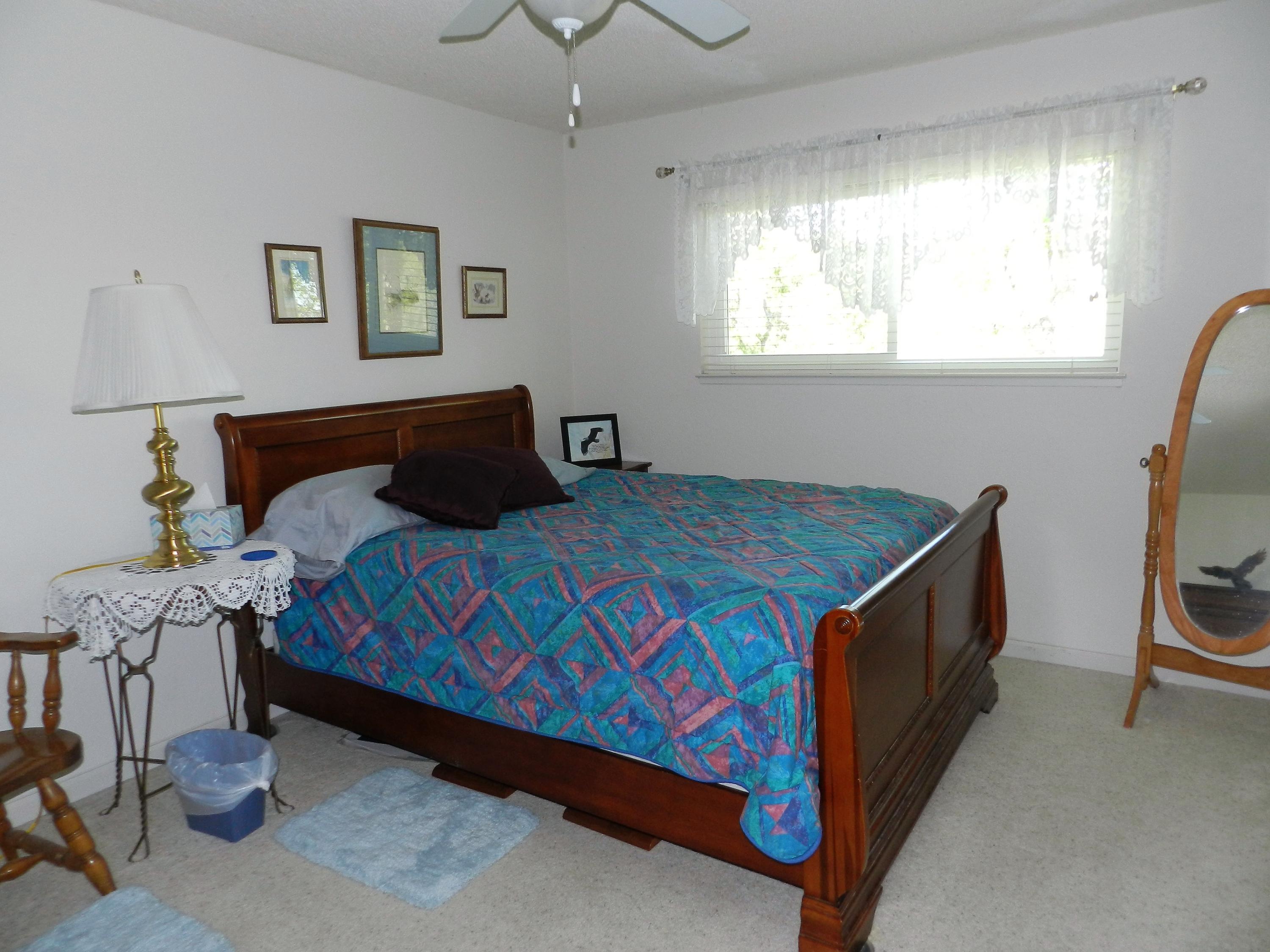 8760 Valley View Road Redding, CA 96001 - Photo 15 of 42 a bedroom with a bed and a window