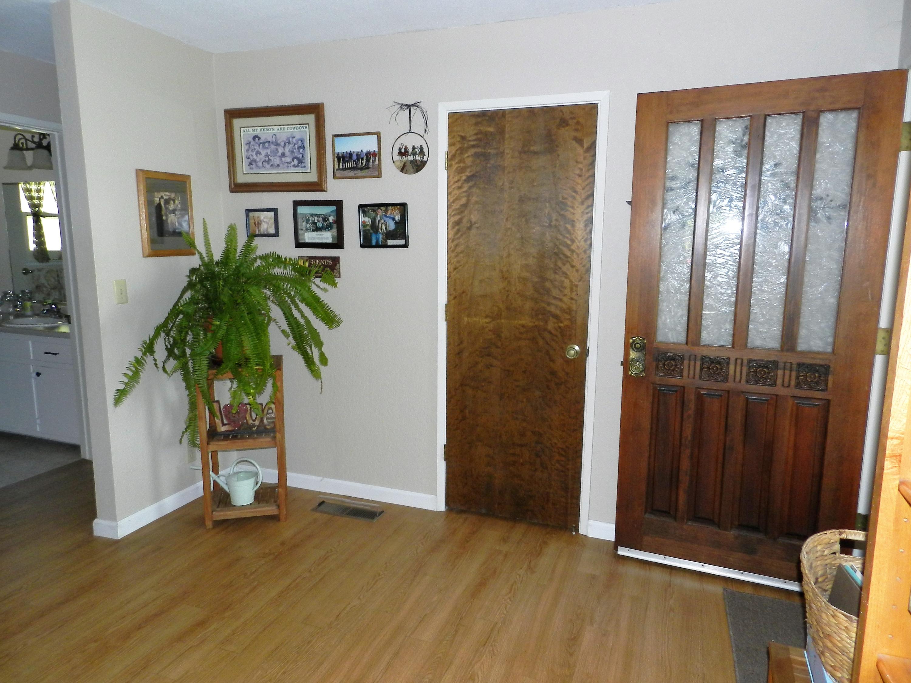 8760 Valley View Road Redding, CA 96001 - Photo 17 of 42 an empty room with windows and hardwood floor