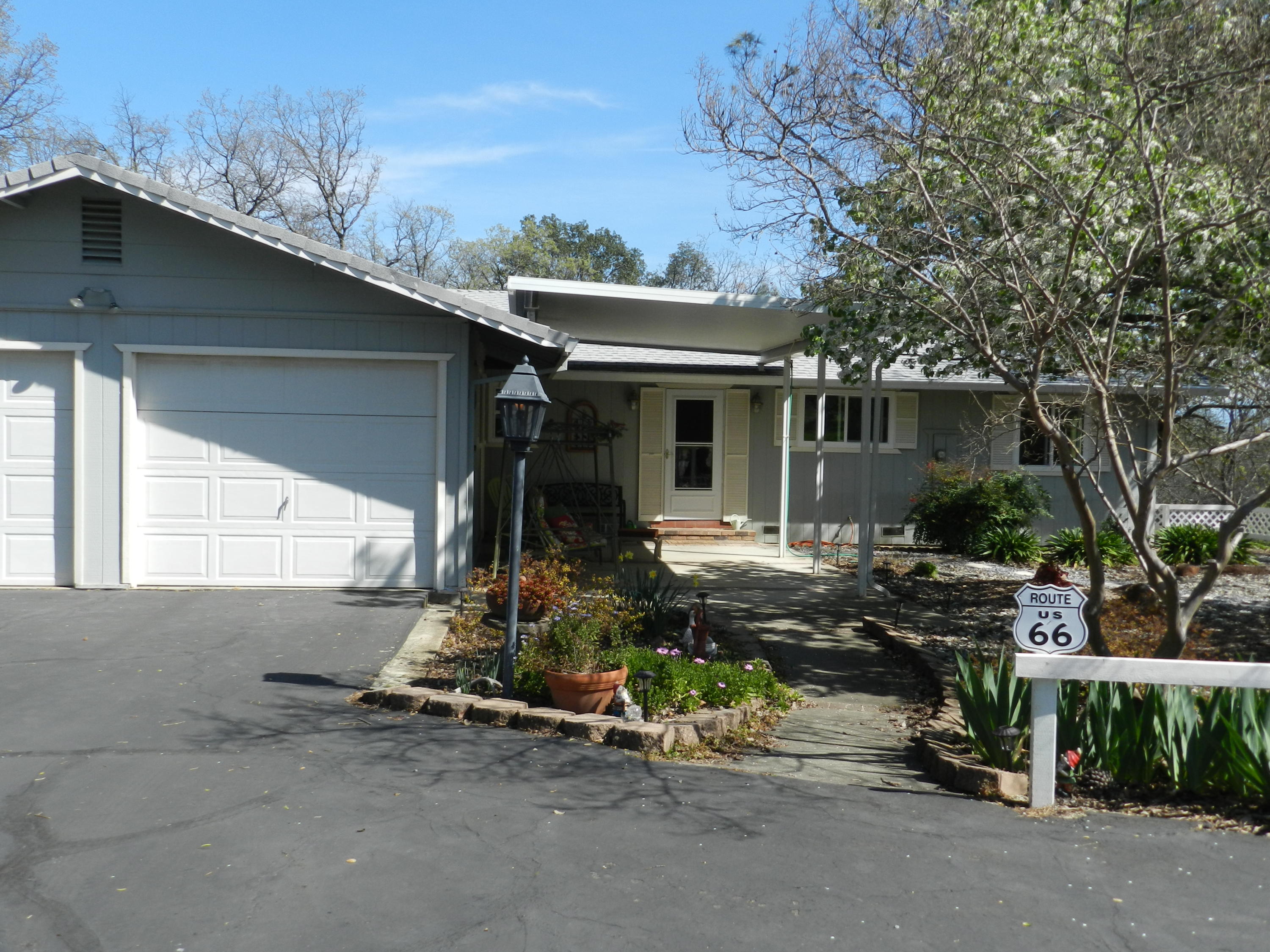 8760 Valley View Road Redding, CA 96001 - Photo 21 of 42 a view of a house with backyard and sitting area
