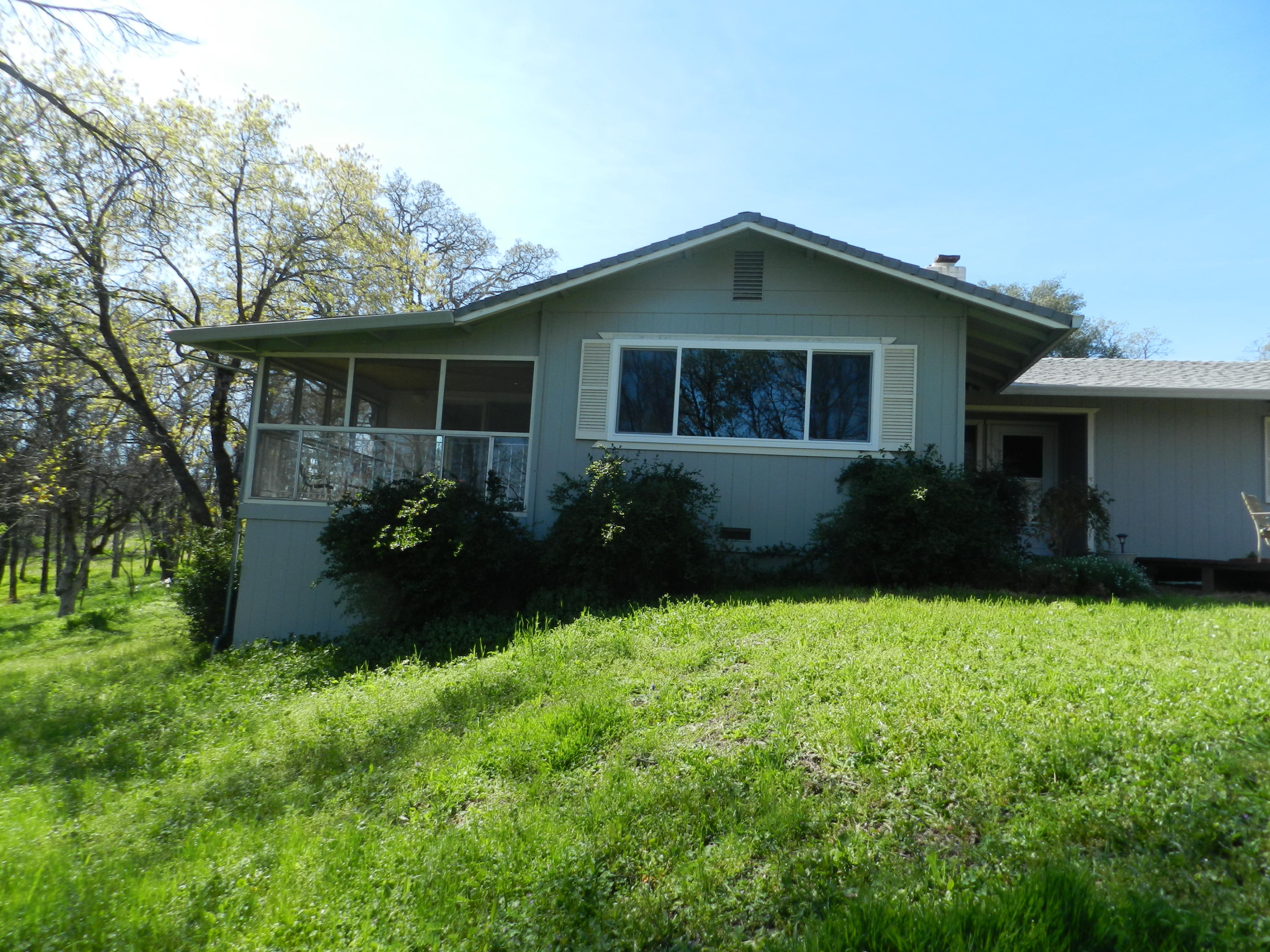 8760 Valley View Road Redding, CA 96001 - Photo 23 of 42 a front view of a house with garden