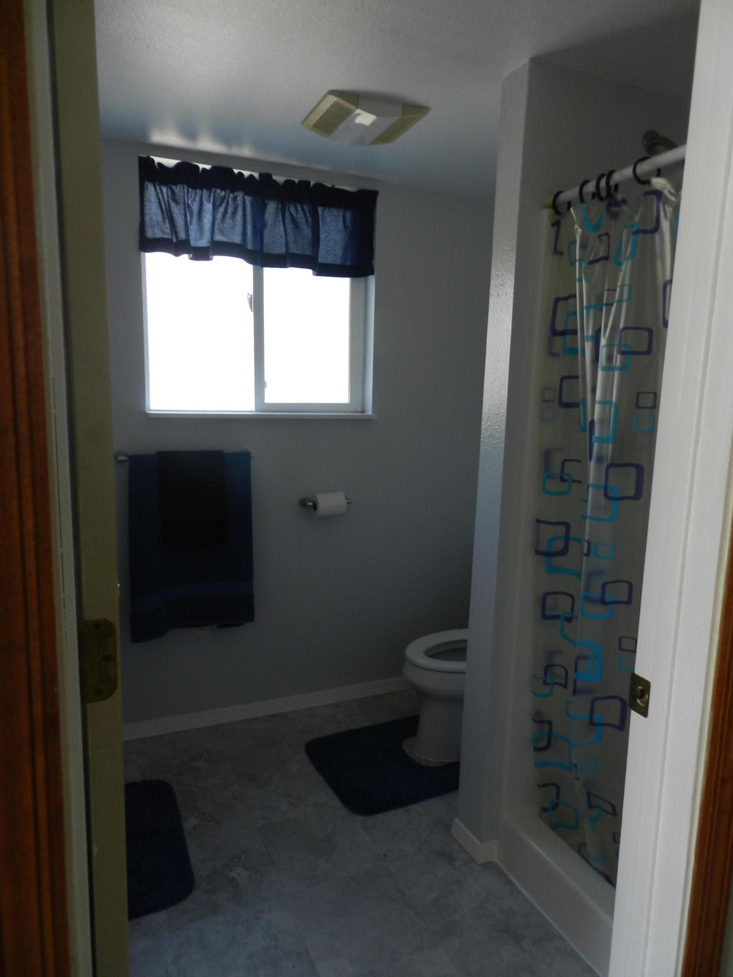8760 Valley View Road Redding, CA 96001 - Photo 33 of 42 a bathroom with a toilet and a shower