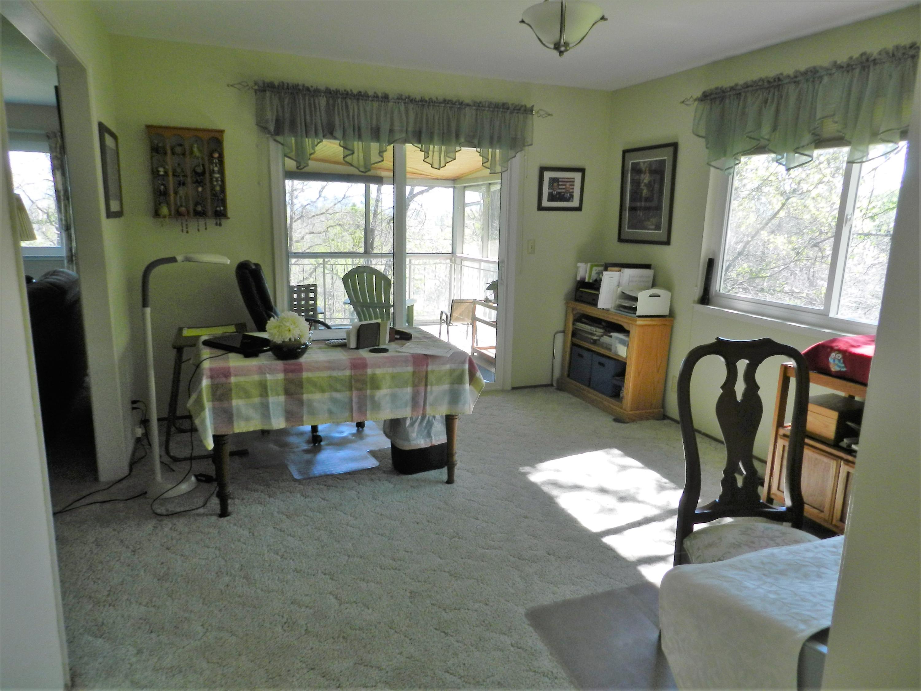 8760 Valley View Road Redding, CA 96001 - Photo 6 of 42 a living room with furniture and a large window