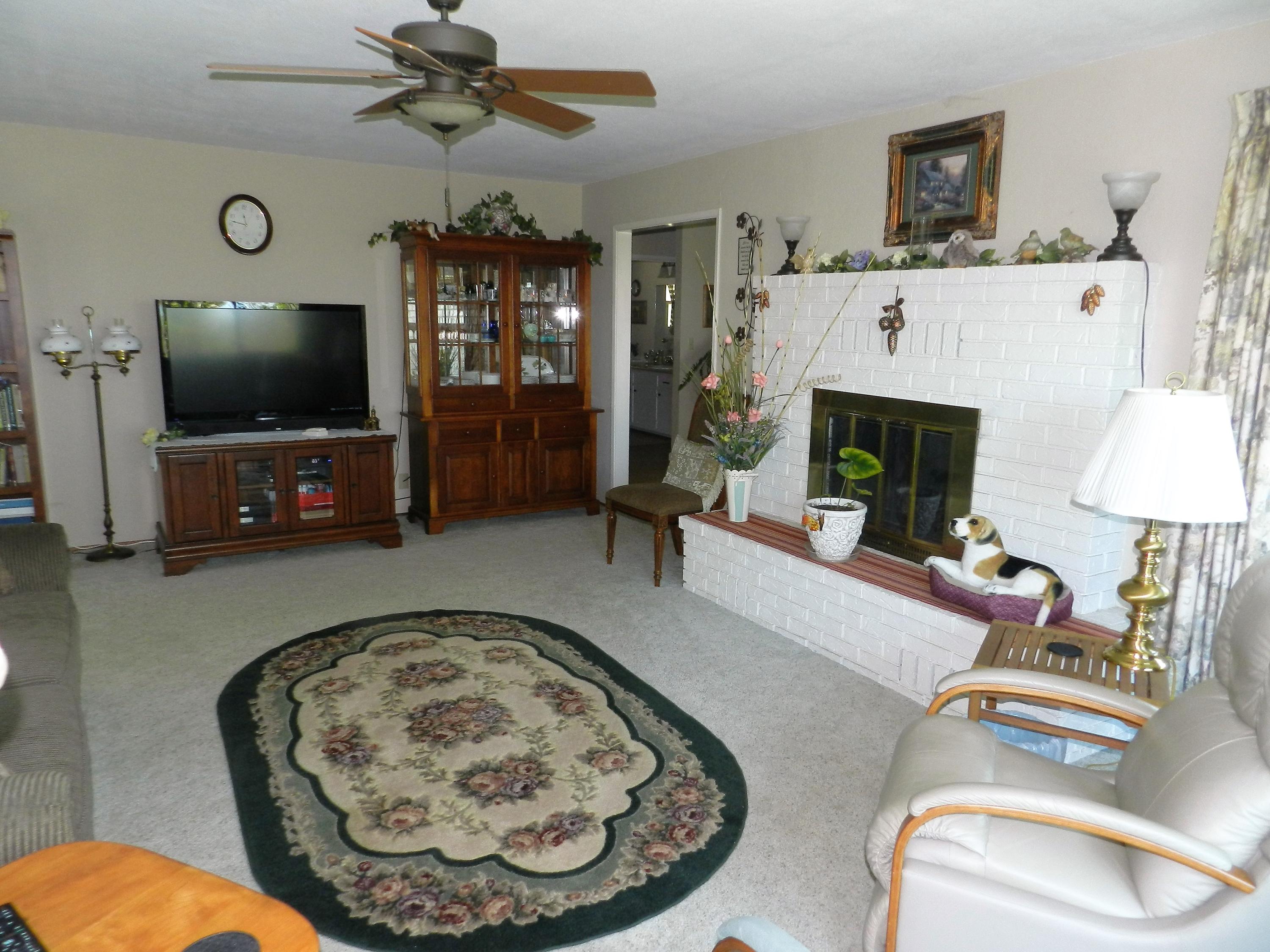 8760 Valley View Road Redding, CA 96001 - Photo 8 of 42 a living room with furniture and a flat screen tv