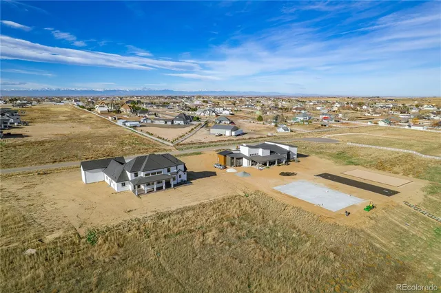 a view of a house with a snow on the road