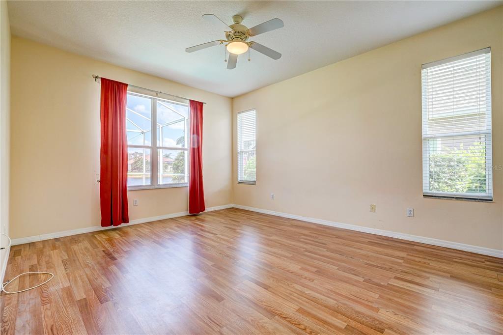 5621 52nd Avenue West Bradenton, FL 34210 - Photo 14 of 33 a view of empty room with wooden floor and fan