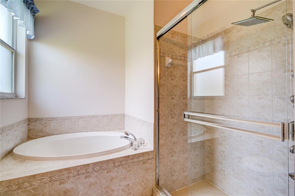 5621 52nd Avenue West Bradenton, FL 34210 - Photo 18 of 33 a bathroom with a bathtub and a shower