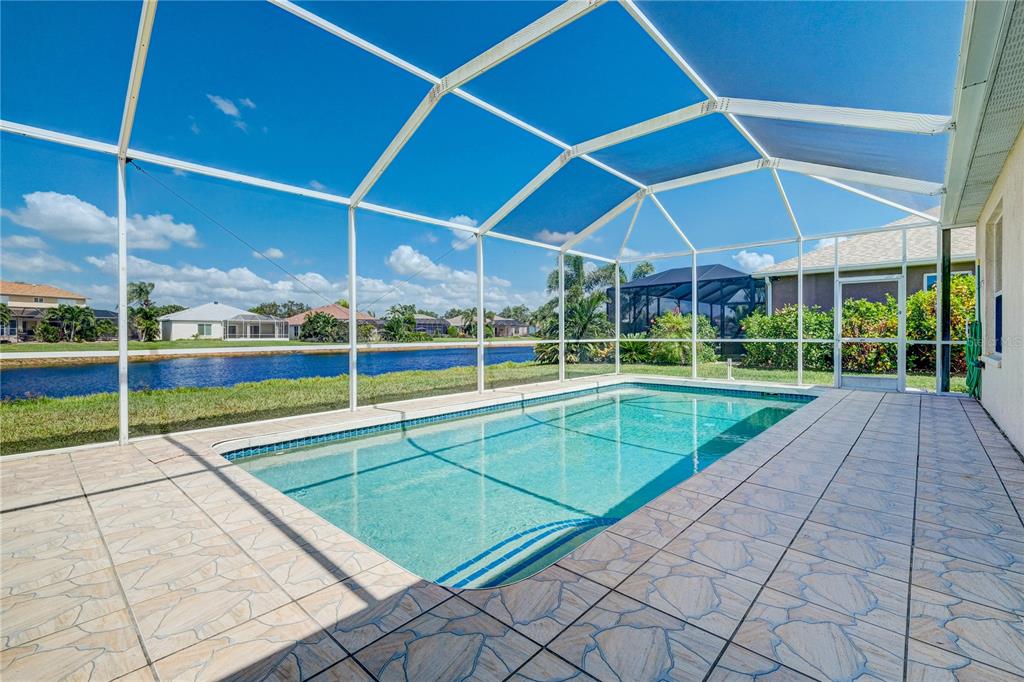 5621 52nd Avenue West Bradenton, FL 34210 - Photo 2 of 33 a view of a backyard with swimming pool