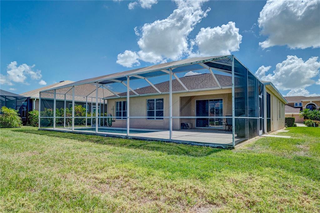 5621 52nd Avenue West Bradenton, FL 34210 - Photo 31 of 33 a view of a house with a yard and sitting area