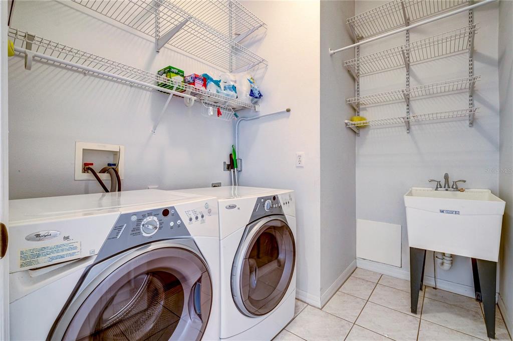 5621 52nd Avenue West Bradenton, FL 34210 - Photo 32 of 33 a utility room with dryer and washer
