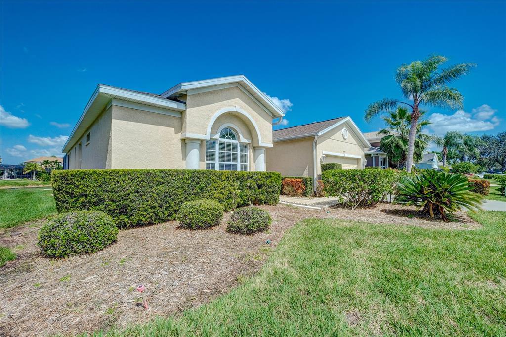 5621 52nd Avenue West Bradenton, FL 34210 - Photo 33 of 33 a front view of a house with a yard