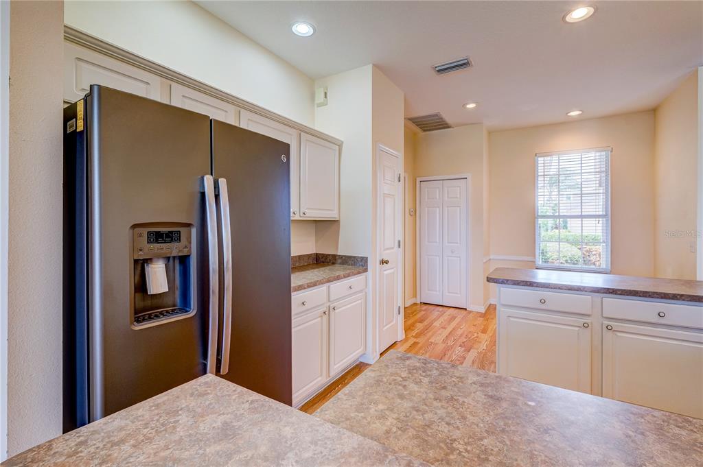 5621 52nd Avenue West Bradenton, FL 34210 - Photo 7 of 33 a kitchen with stainless steel appliances granite countertop a refrigerator and a sink