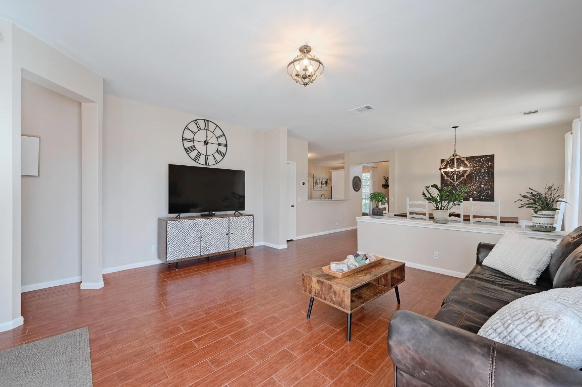 400 Tobin Drive Buda, TX 78610 - Photo 12 of 40 Living room with a chandelier