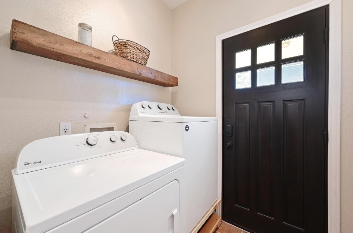 400 Tobin Drive Buda, TX 78610 - Photo 18 of 40 Laundry room off carport, featuring washer and dryer (may convey)