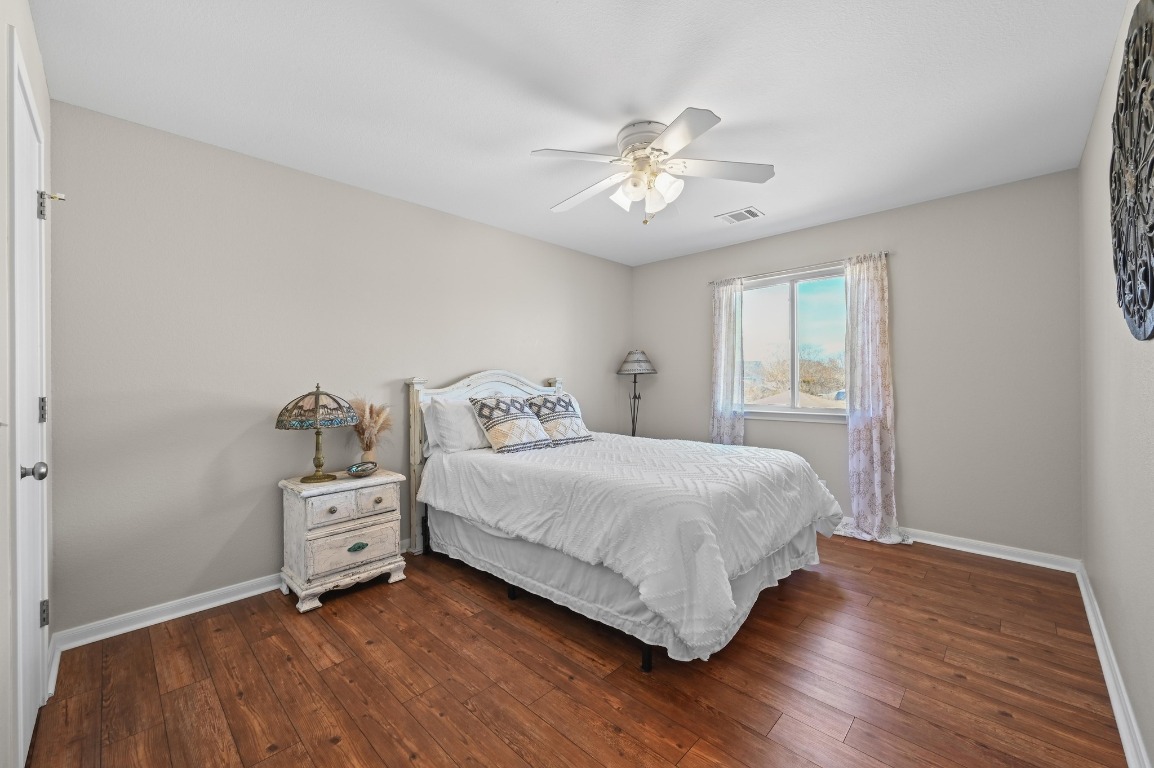 400 Tobin Drive Buda, TX 78610 - Photo 31 of 40 Bedroom with wood-style floors and ceiling fan