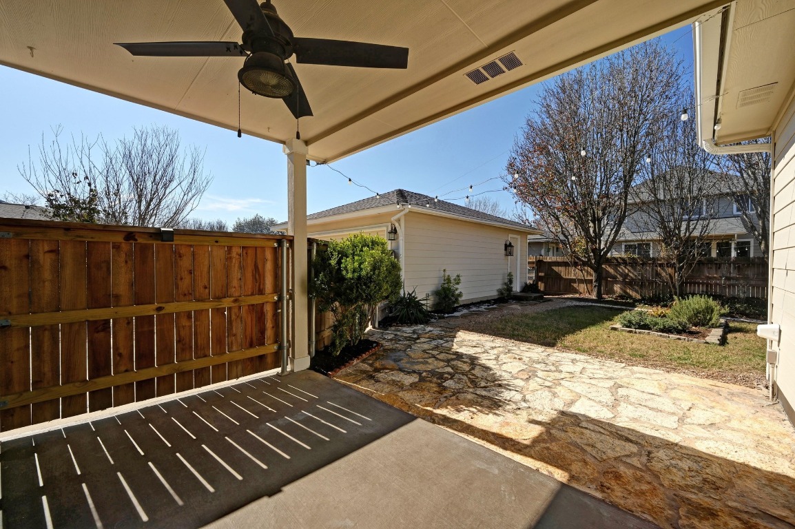 400 Tobin Drive Buda, TX 78610 - Photo 33 of 40 Fenced backyard with a patio and a ceiling fan