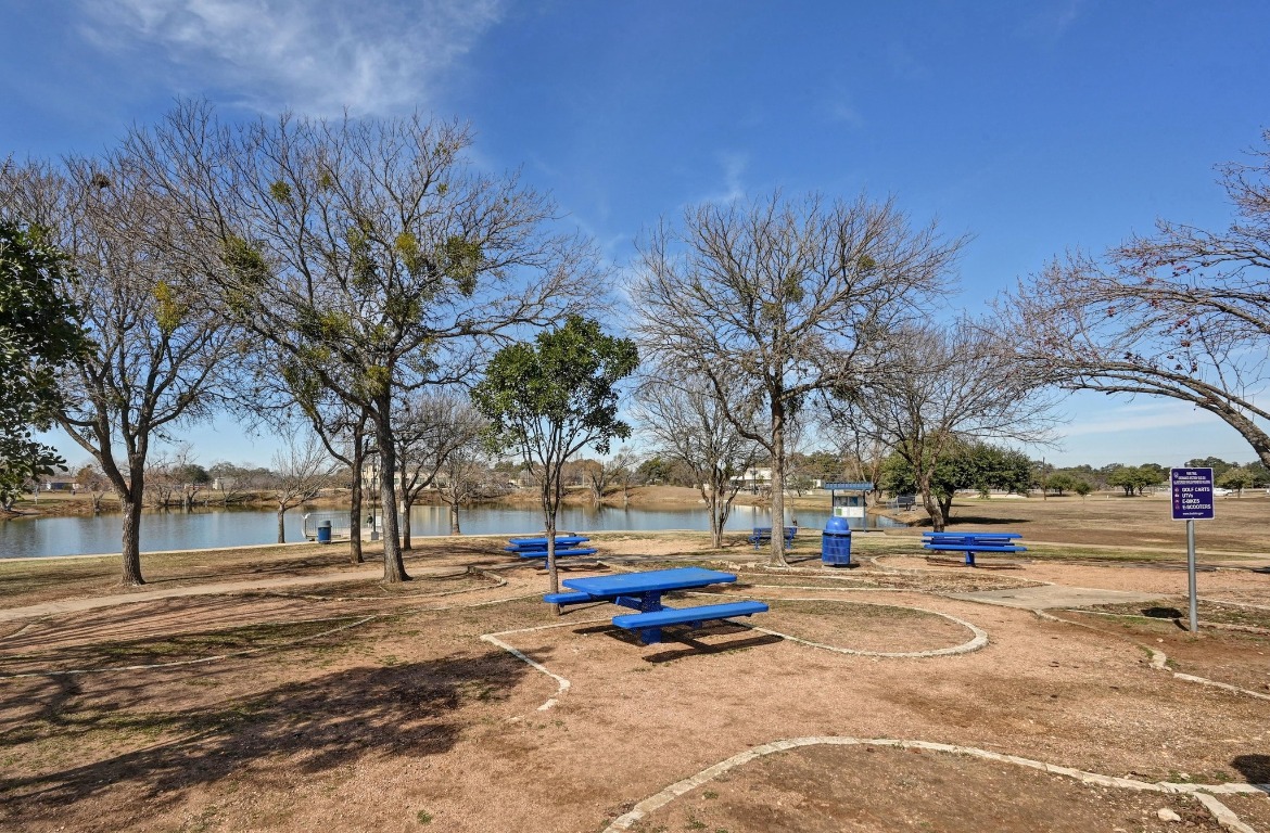 400 Tobin Drive Buda, TX 78610 - Photo 37 of 40 View of property's community with a water view and picnic tables