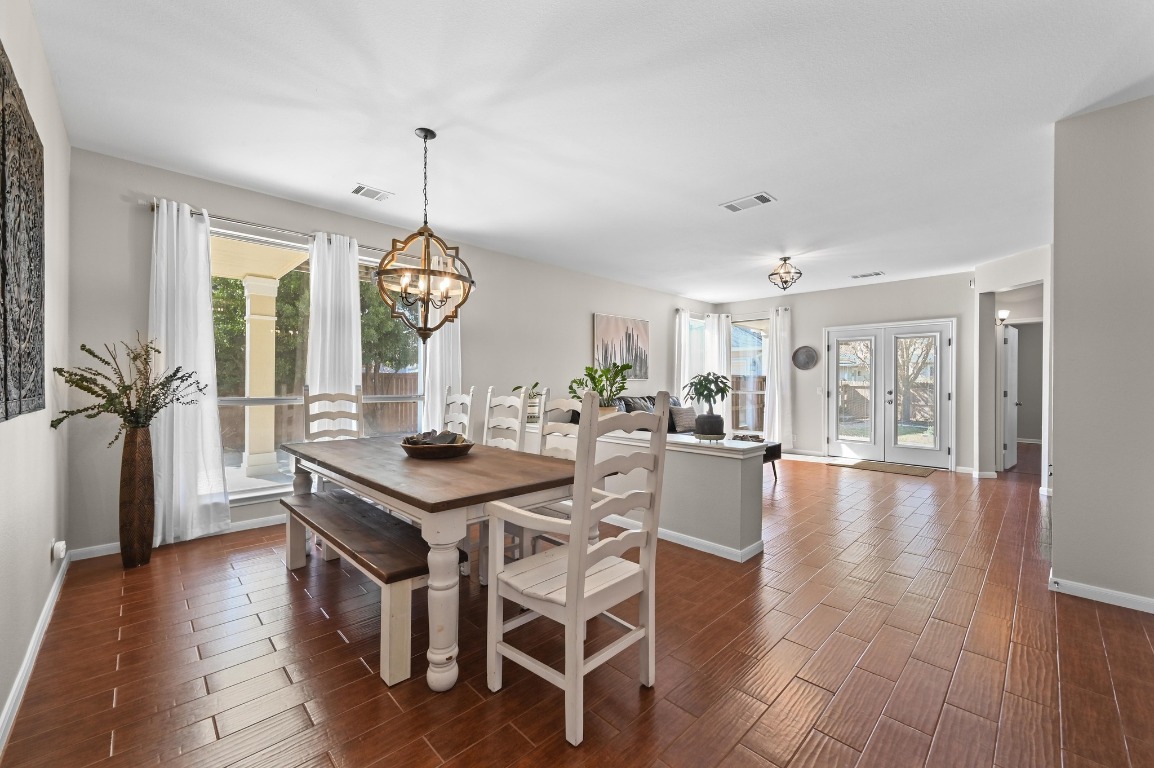 400 Tobin Drive Buda, TX 78610 - Photo 7 of 40 Formal dining space featuring a chandelier, and plenty of natural light