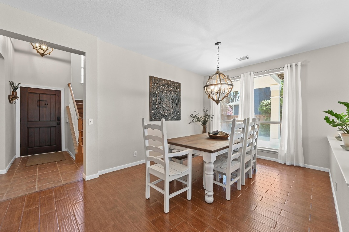 400 Tobin Drive Buda, TX 78610 - Photo 8 of 40 Dining area with a chandelier