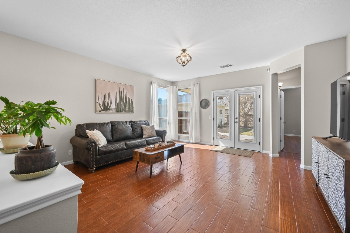 400 Tobin Drive Buda, TX 78610 - Photo 10 of 40 Living room featuring french doors leading to the covered back patio