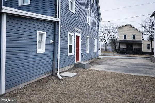 a view of a house with a street