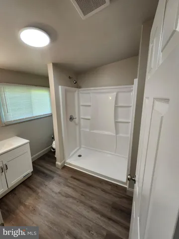 an empty room with a empty space and a window