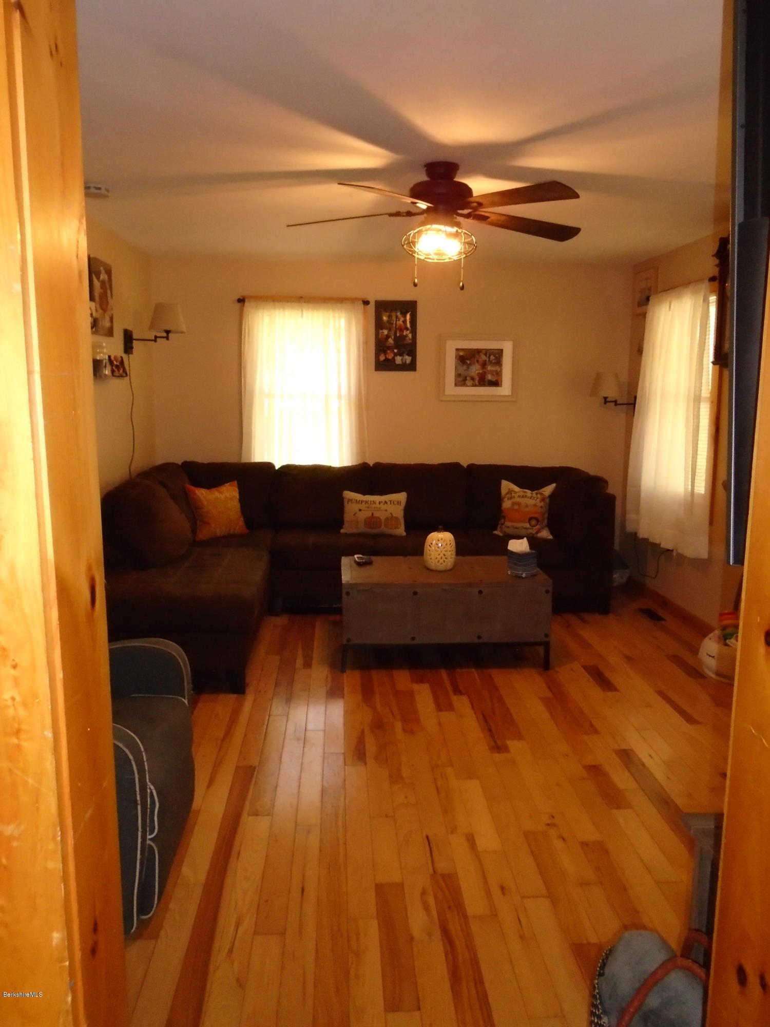 4 River Road Savoy, MA 01256 - Photo 14 of 39 a living room with couches and painted walls with wooden floor