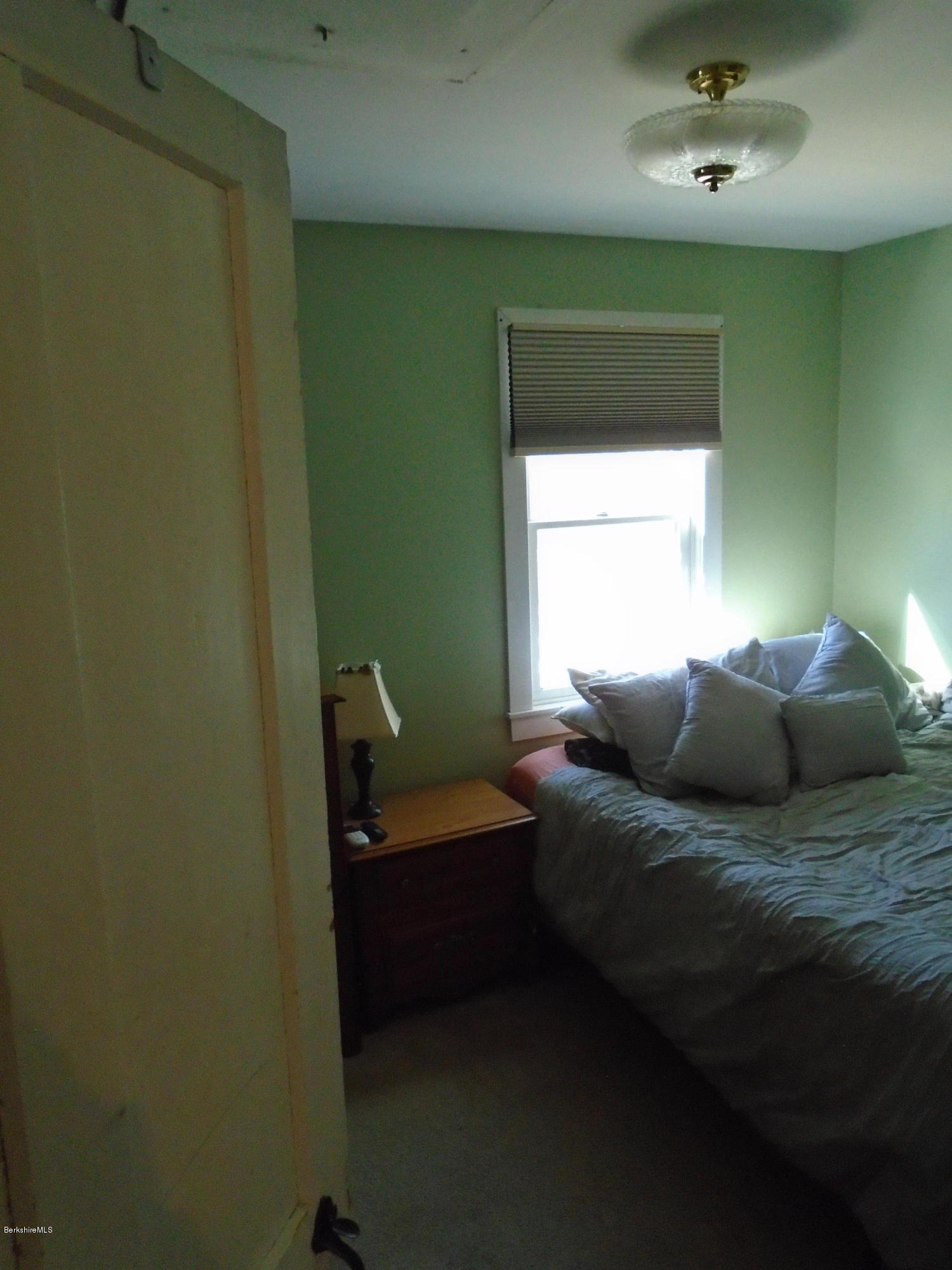 4 River Road Savoy, MA 01256 - Photo 18 of 39 a bedroom with a bed and a window