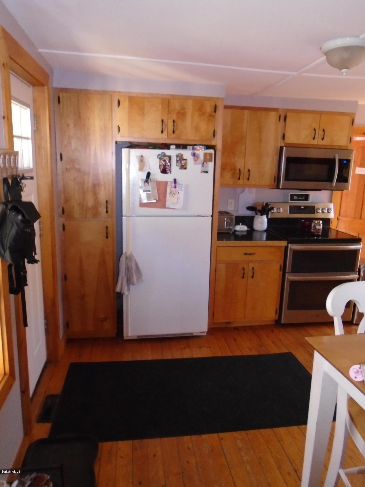 4 River Road Savoy, MA 01256 - Photo 19 of 39 a kitchen with stainless steel appliances a refrigerator and a stove